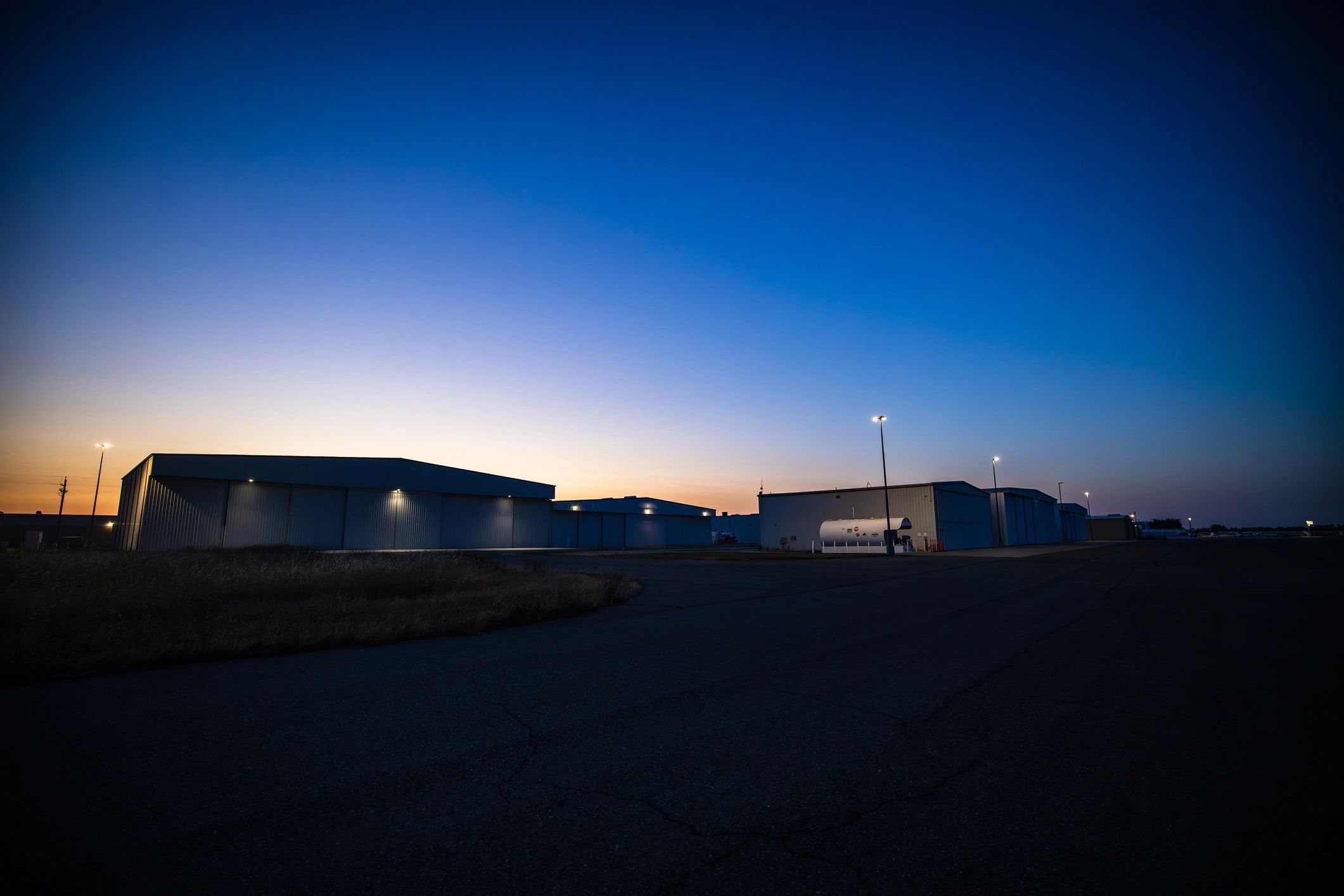Industrial facility exterior at dusk representing energy infrastructure