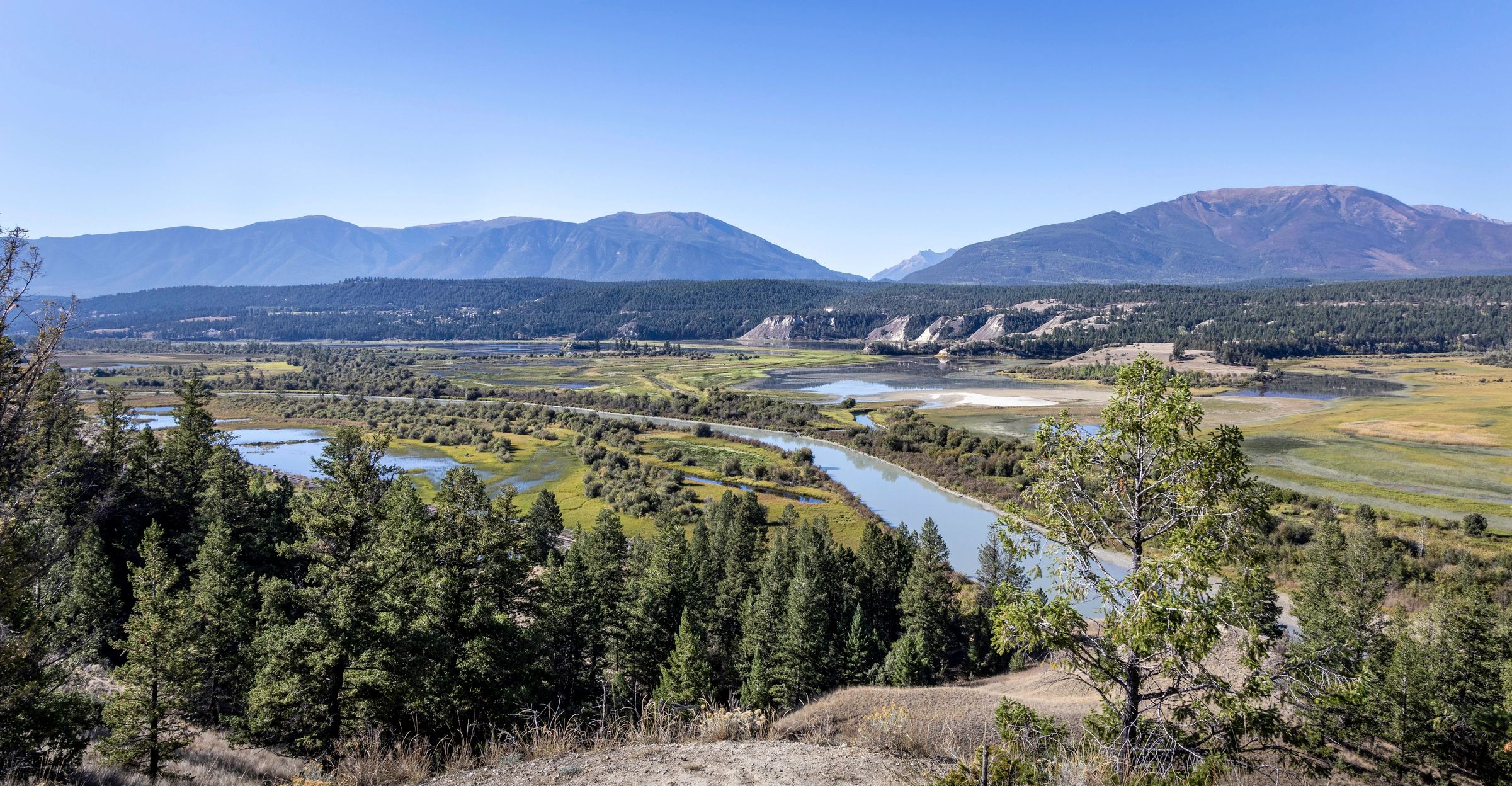 British Columbia valley landscape with river and mountains