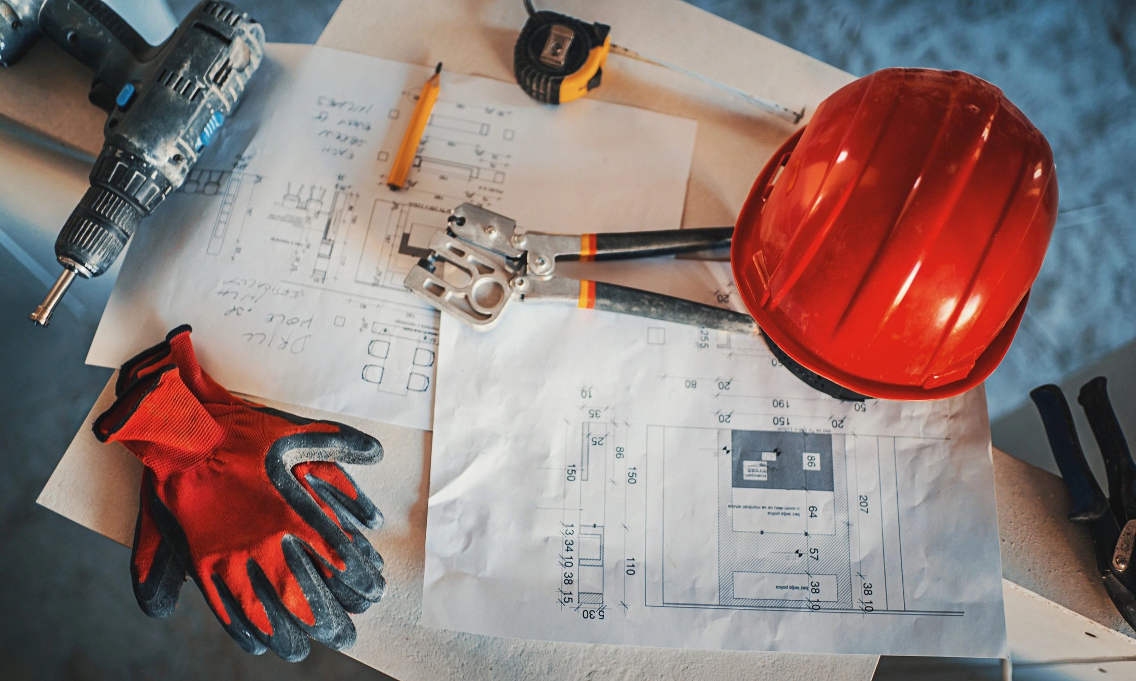 Engineering paperwork and clipboards with electrical test tools (no people)